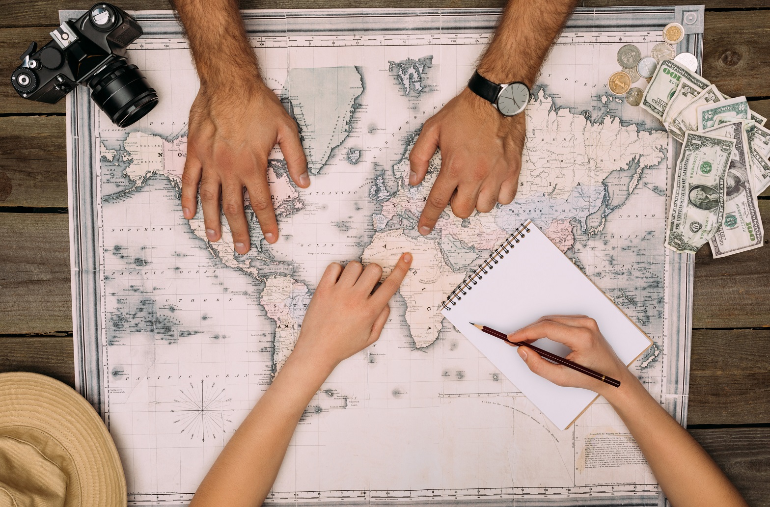Couple planning travel over a map
